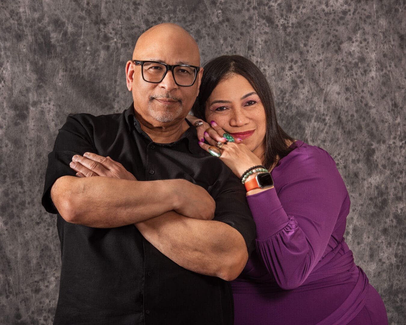 A man and woman posing for a picture.